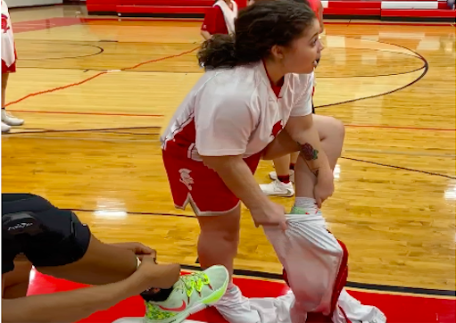 Mak Swan tearing off her iconic pregame warmup pants. 