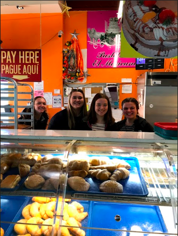 Seniors Quinn Elsenbast, Emma Bearson, Mia Rheineck and Anna Kocourek pick out pastries at Mercado Central. 