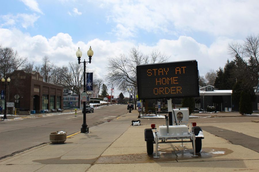 A sign in downtown Excelsior announces Minnesotas stay-at-home order as a result of the coronavirus pandemic sweeping the nation.