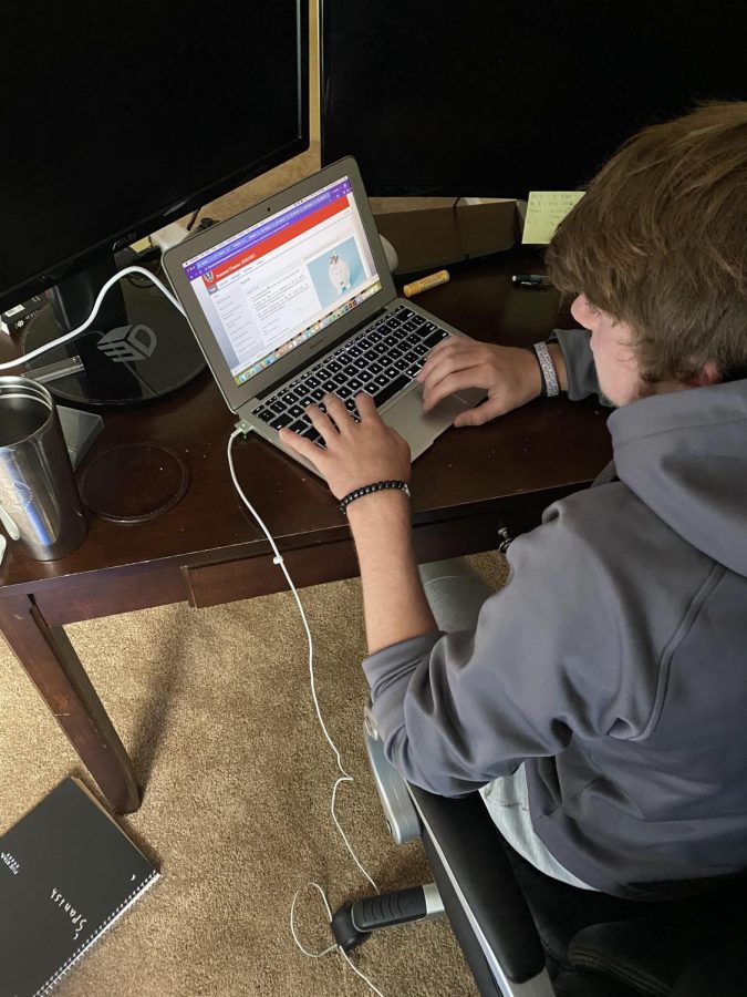 Boys varsity soccer captain Drew Clark attends school online to protect the health of his teammates.