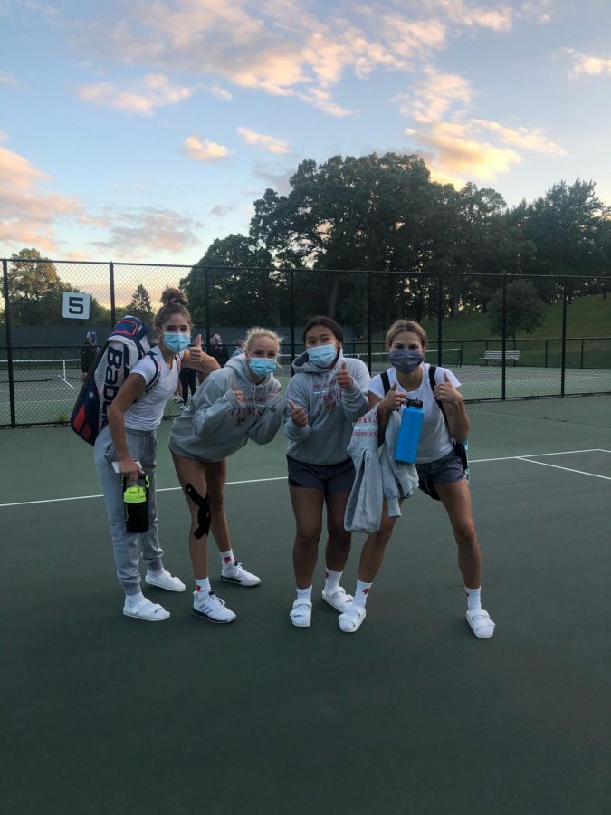 Lily Eigner (middle left) with her teammates after a 7-0 win against Washburn at Kenwood Park.