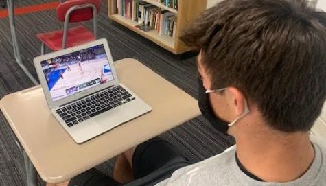 Junior Brady Wine watches NBA Bubble action between the LA Lakers and the Miami Heat in the NBA Finals.