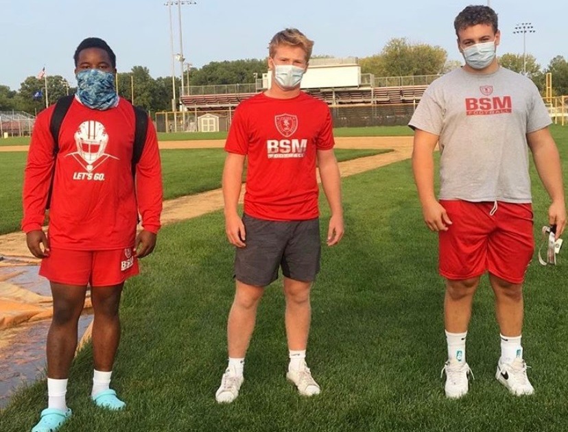 Senior+football+captains+William+Petty+%28left%29%2C+George+Wolfe+%28middle%29%2C+and+Nick+Marinaro+%28Right%29+mask-up+while+preparing+for+the+football+season.