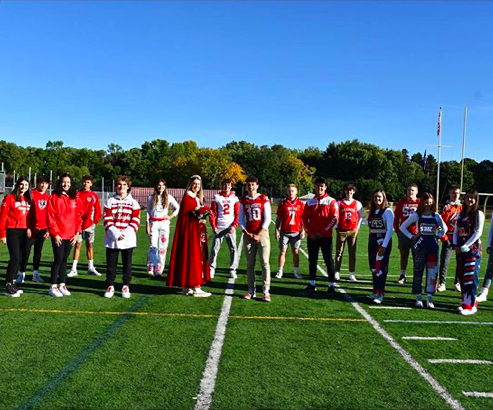 Homecoming King and Queen Lucio Fialo and Lauren Hawkinson (front center) pose along with other Senior Class finalists and class representatives at the unique Homecoming Coronation which took place on Friday, September 18th.