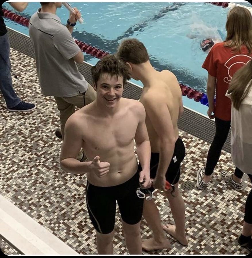 Casey Prindiville smiles after his performance at a swim meet last season.