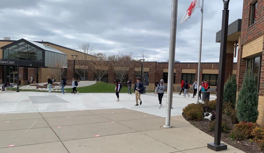 Cohort 2 students walk out of school at the end of their block day. Tomorrow they will be learning from home.