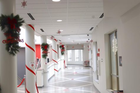 The space near the Atrium is festooned with garland and ribbon.