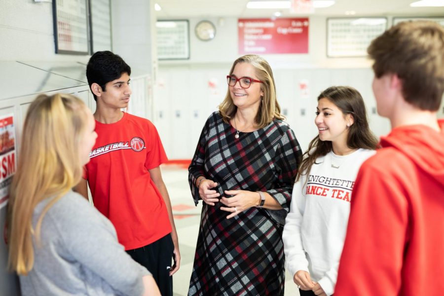 In a photoshoot from last year, BSM Principal Dr. Susan Skinner talks with students in the hallway. Now, Skinner plans her departure from BSM.