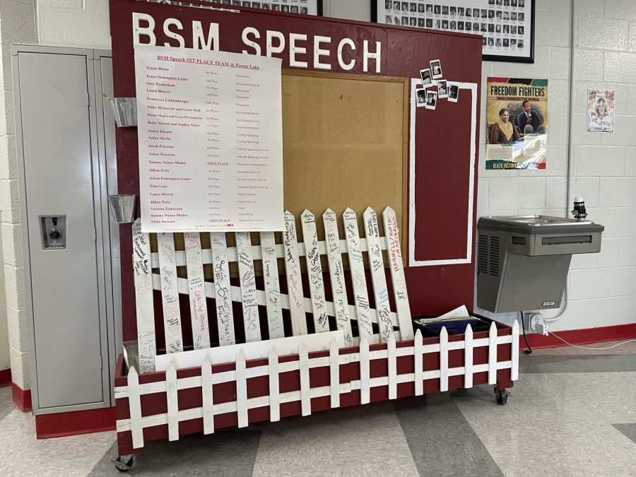 Students who take first place in all their rounds at speech tournaments have the honor of signing the picket fence.