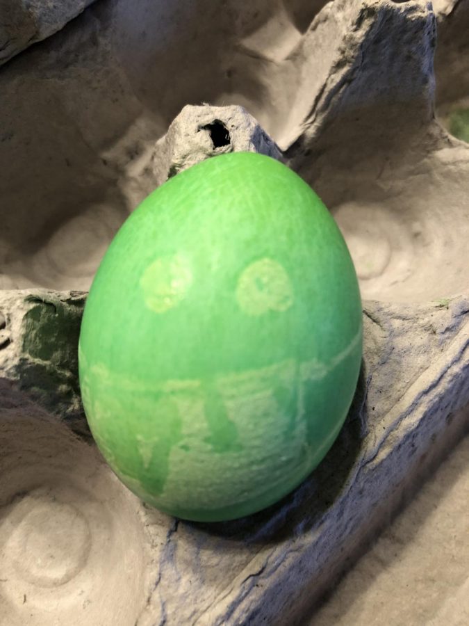 An Easter egg with a mask demonstrates the need for creative community building in these challenging times.