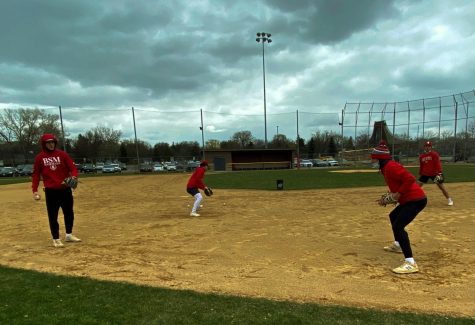 Out on the field, Red Knights participate in a game of catch to prep for the season.