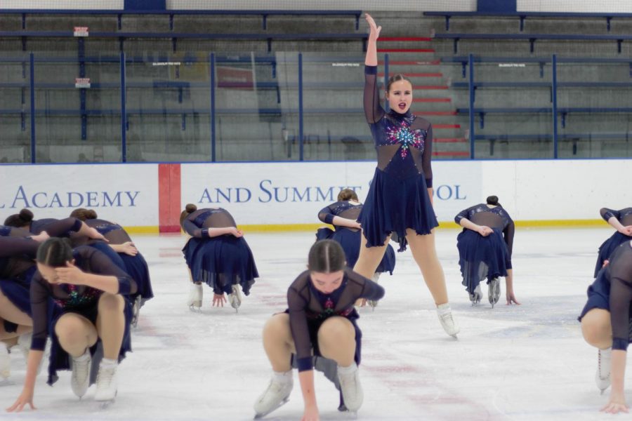 Senior Anna Medina strikes a pose during a figure skating competition.