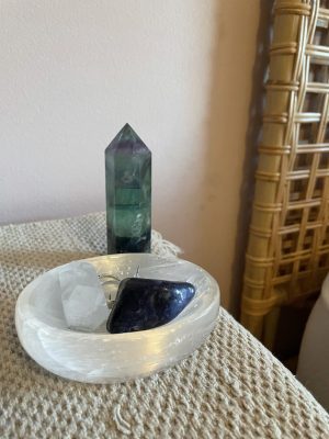 Beautiful crystals on someones nightstand are boosting the energy level in the room.