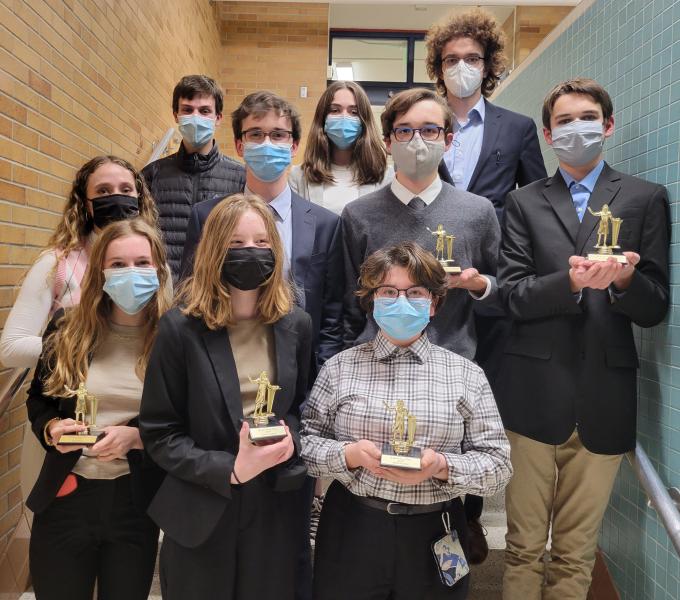 The BSM Debate Team poses with their trophies after a successful Robbinsdale-Cooper tournament.