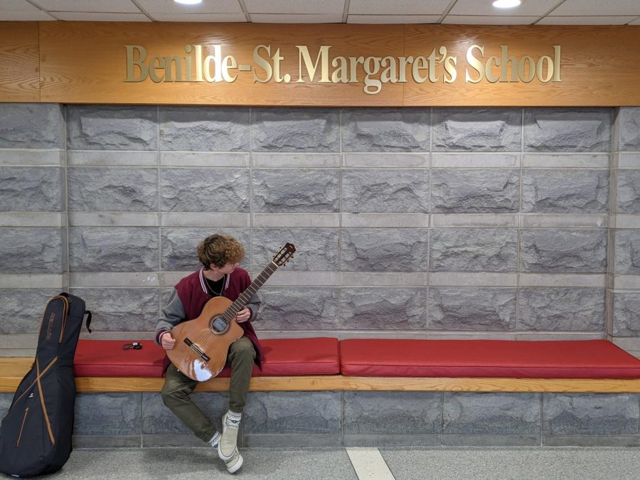 Liam DePauw plays his classical guitar in the BSM lobby after commuting to school from the University of Minnesota.
Not pictured: Max Freytag, Ryan Long