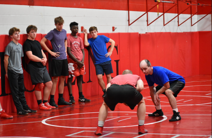 Coach Gettel and Coach Redden demonstrate for Simon Carlisle (9th grade Chesterton Academy), Bryce Commerford (11th grade Benilde - St. Margarets), Thomas Medina (11th grade Benilde-St. Margarets), Deangelo Addison(10th grade Benilde -St. Margarets), Andrew Carlisle (11th grade Chesterton Academy).