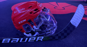 The Bauer Supreme UltraSonic Stick and Benilde-St. Margarets Girls CCM Hockey Helmet reveal the battle of the brands in hockey.