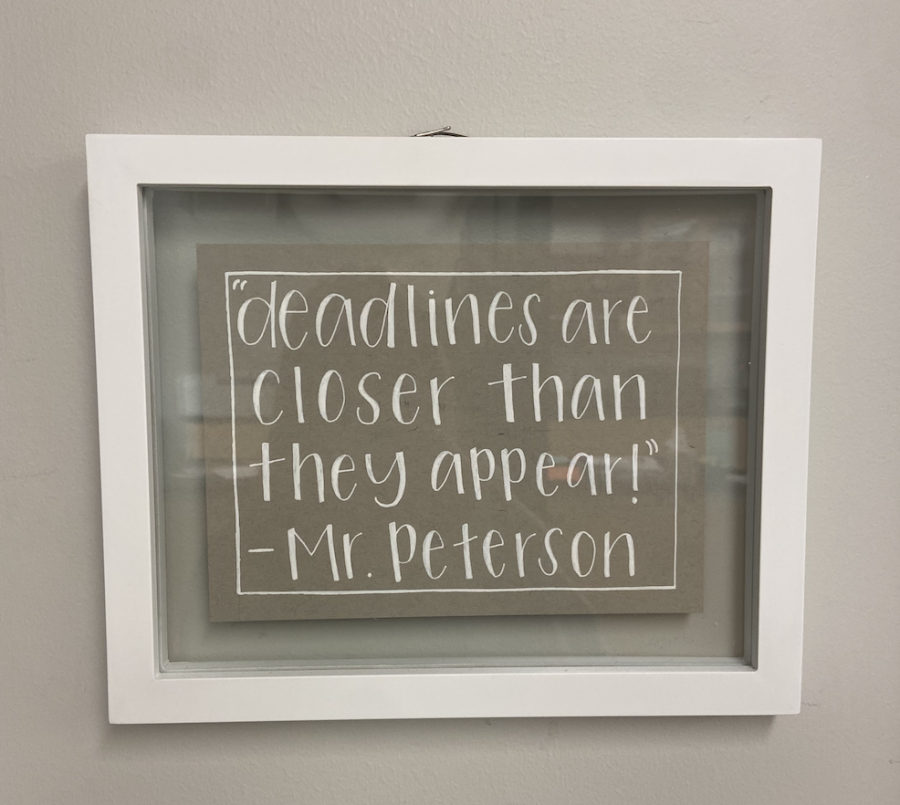 A framed letter gifted to science teacher, Mr. Peterson by a former student displaying his chosen catchphrase in his classroom.