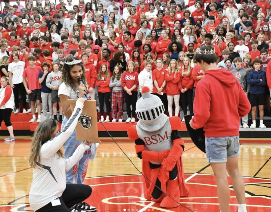 Victor E. Knight is knighted by Ryan Baird, Sierre Lumpkin, and Cami Dahlstrom at the Homecoming Pep Fest.