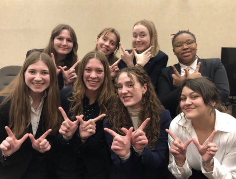 The varsity Mock Trial team celebrates one of their many wins.