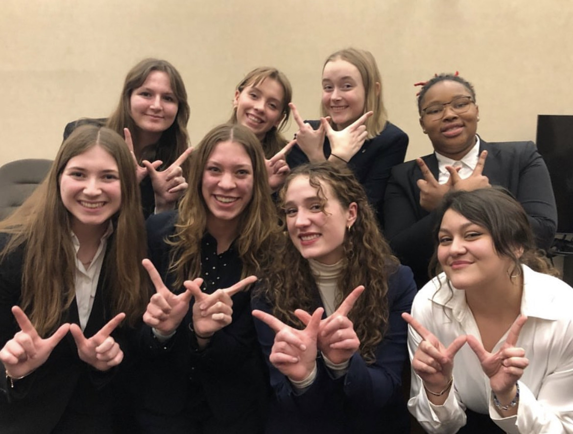 The varsity Mock Trial team celebrates one of their many wins.