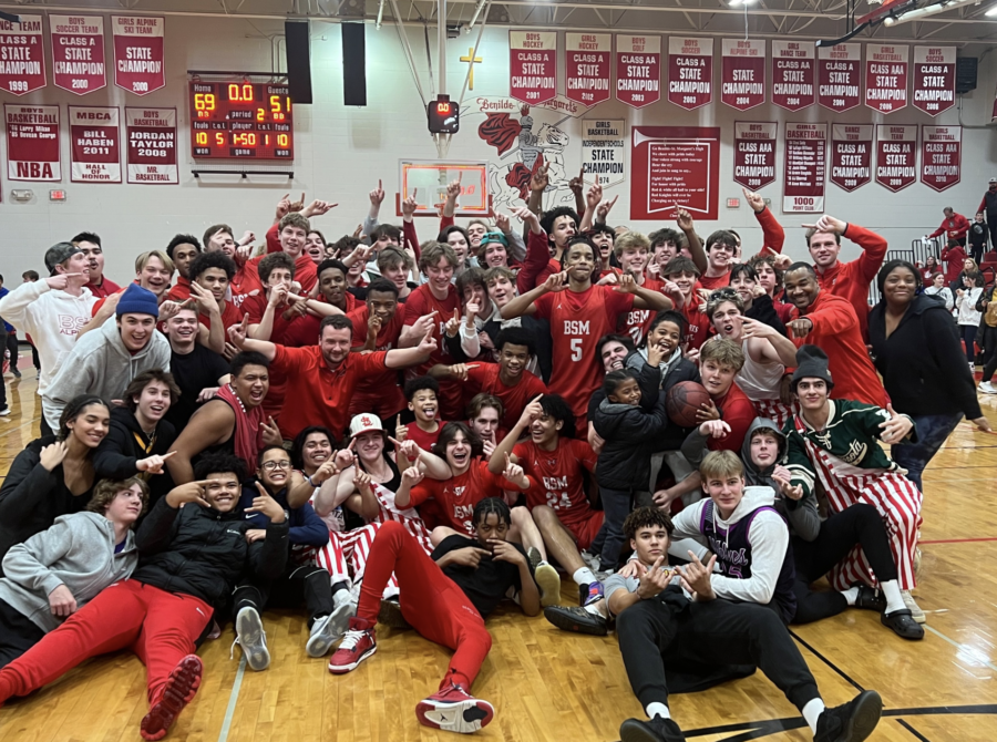BSM boys basketball celebrating #1 seed in conference after last home game