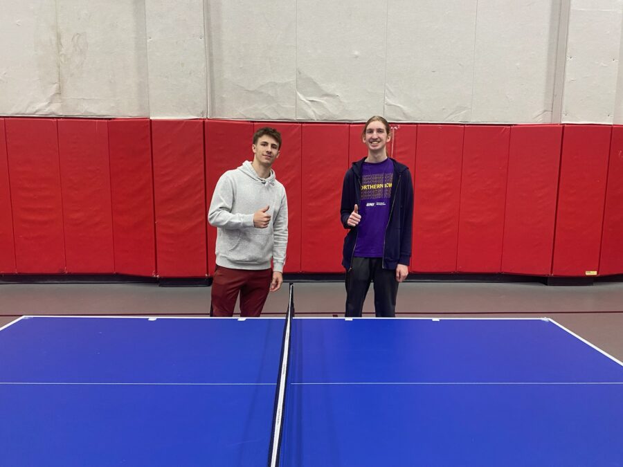 Captain Oscar and Captain Steven competing in the competitive sport Ping Pong.