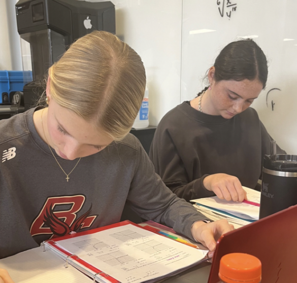 Students Julia Evans and Shale Horning studying very hard during free hour for up coming quarter finals