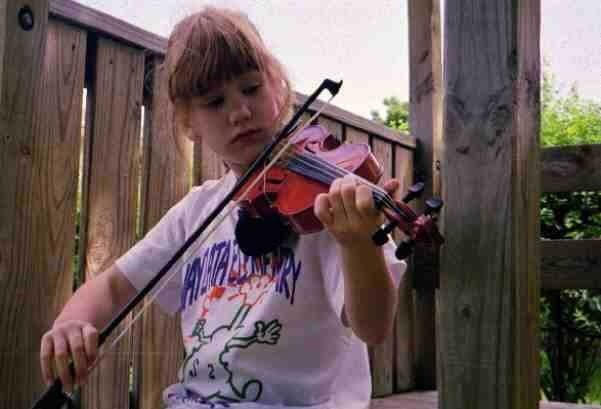 English teacher Jennifer Bevington playing the violin as a child.