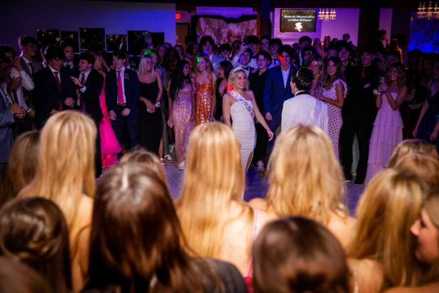 BSM+juniors+and+seniors+display+their+2023+dresses+and+tuxes+on+the+dance+floor.