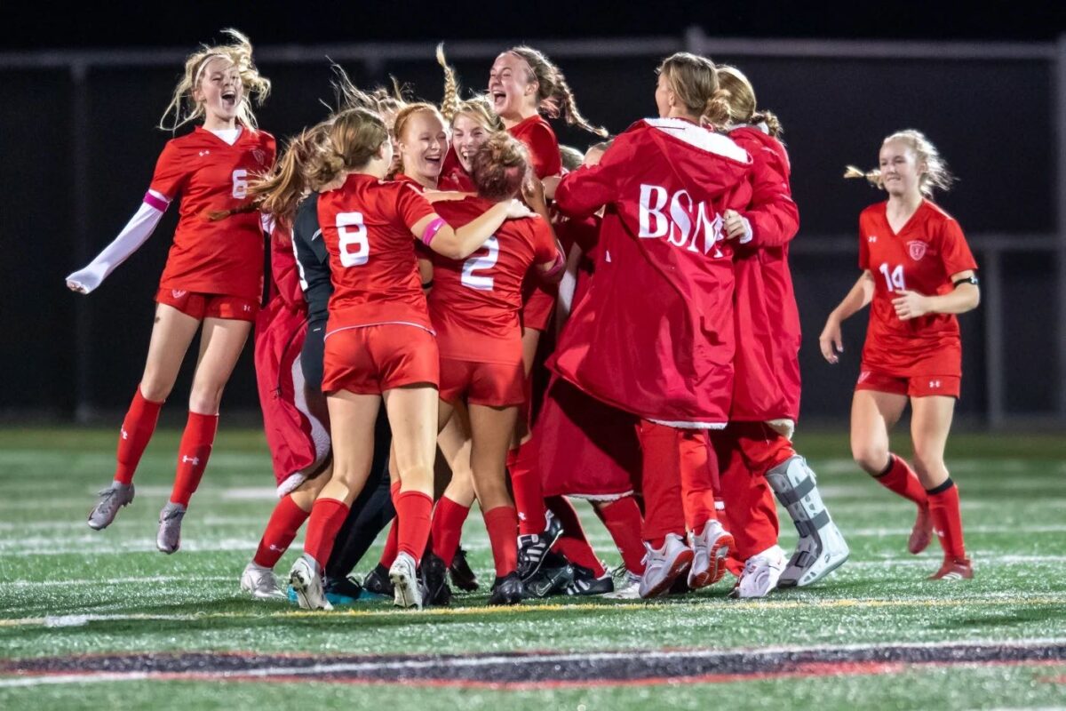 The Red Knights celebrating their 5 to 1 win over Alexandria in the quarterfinals.