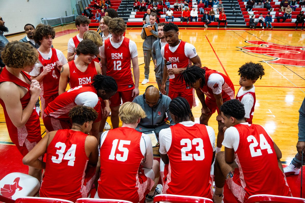 The+BSM+Boys+Basketball+team+draw+up+a+play+during+their+game+against+Mankato+West.