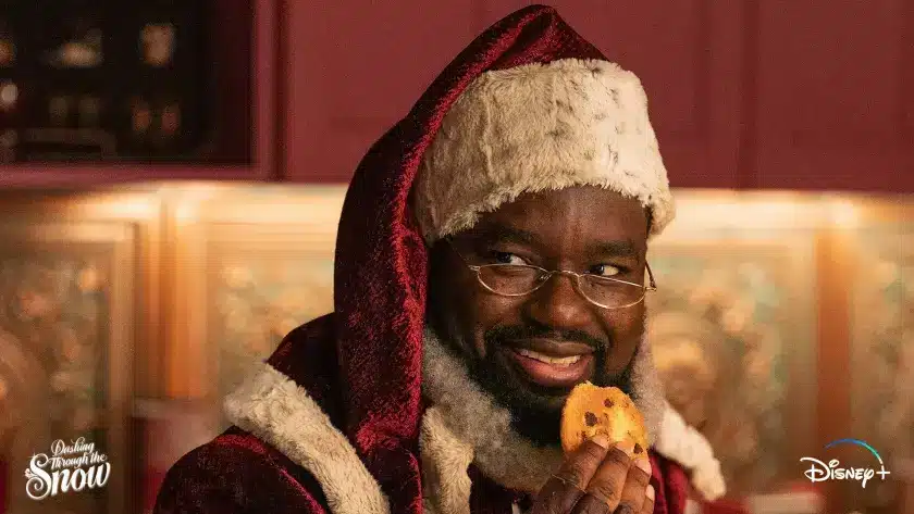 Throughout the movie, many comical scenes such as this one of Santa eating cookies during a tough situation will pop up.