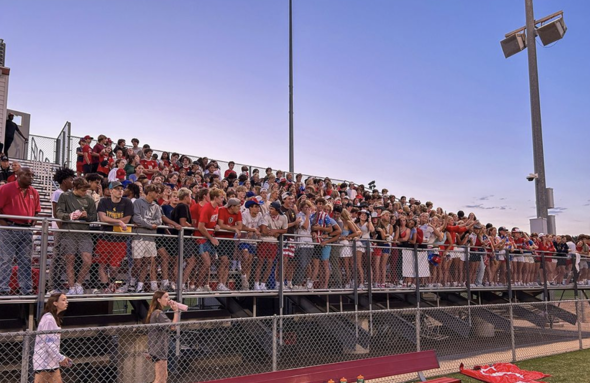 Students packing the stands for a home football game this fall.
