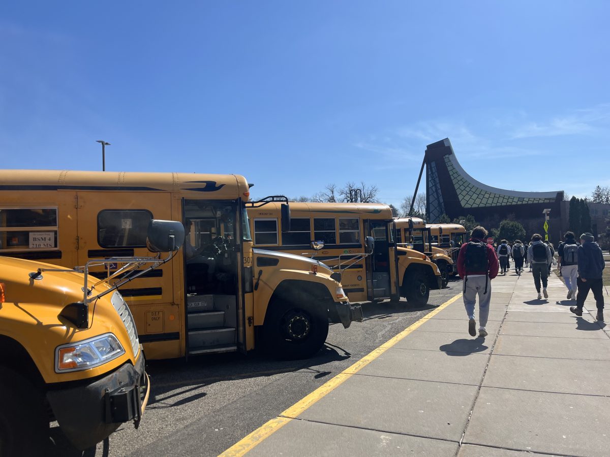 Students get onto their designated busses as the school day comes to a close.