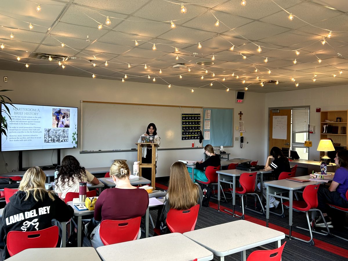 Students in Women of the Church listen intently to student led presentations about the history of women in the Catholic Church.