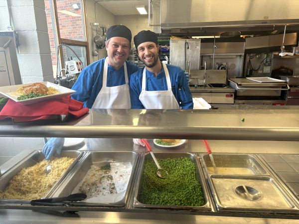 The food service team greets students with big smiles and hearty helpings every day. 