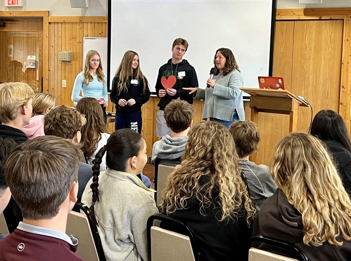 Theology teacher, Mrs. Meagher, gives the ninth graders a lecture on what it means to have patience, generosity, and integrity.