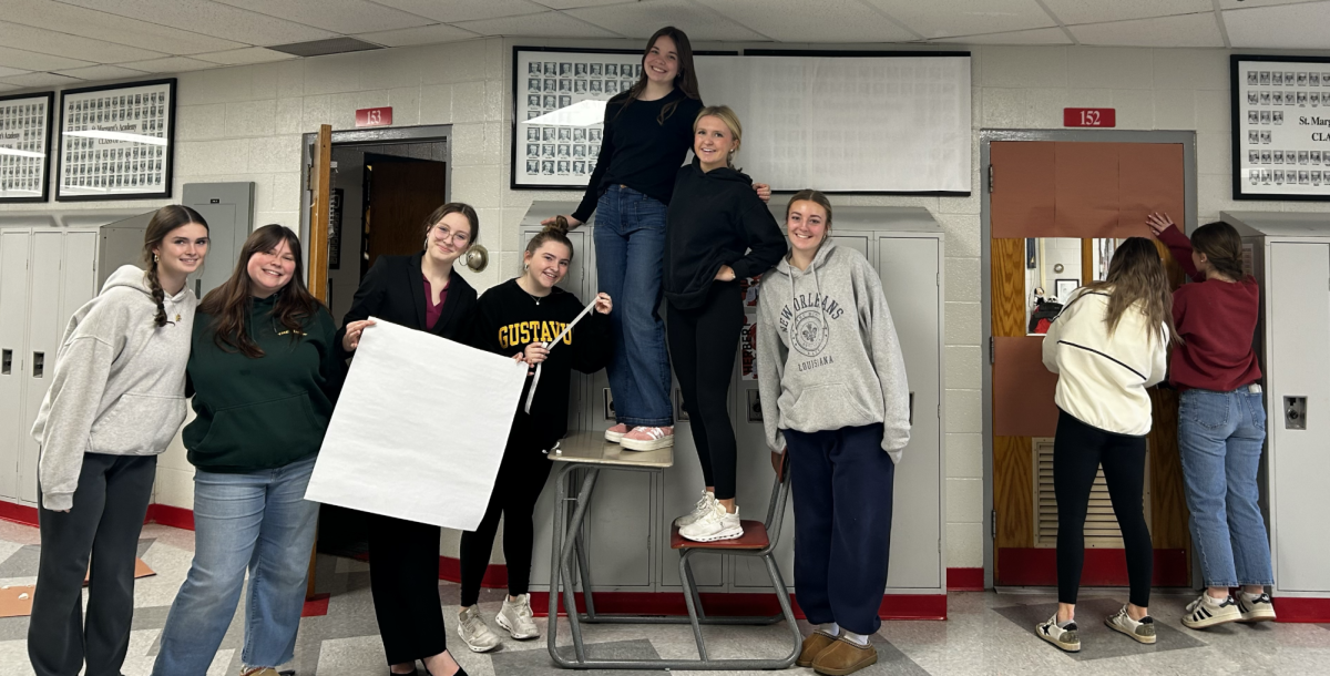 BSM yearbook and the BSM Knight Errant join forces to create their gingerbread-themed door!