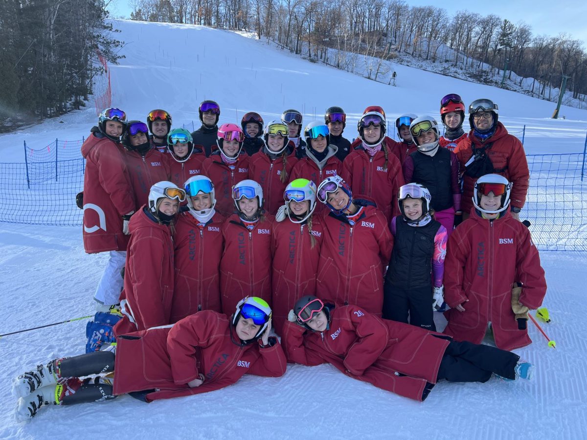 The BSM alpine ski team celebrates a successful competition at the sections tournament. 