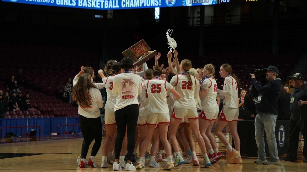 The BSM girls basketball team celebrates as they take home the MSHSL state champion trophy for the third year in a row. 