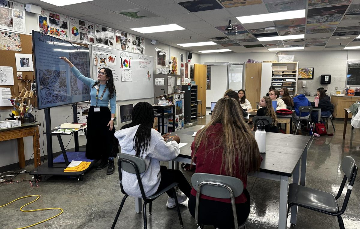 Teacher Ivy Mattson shows her passion for art during an art club meeting.