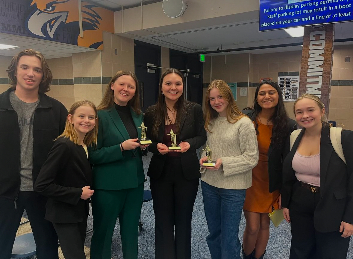 The BSM 2024 Debate Team displays their awards after a successful tournament.